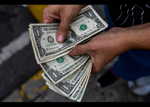 Dollar Ticks Lower by Poor Job Data